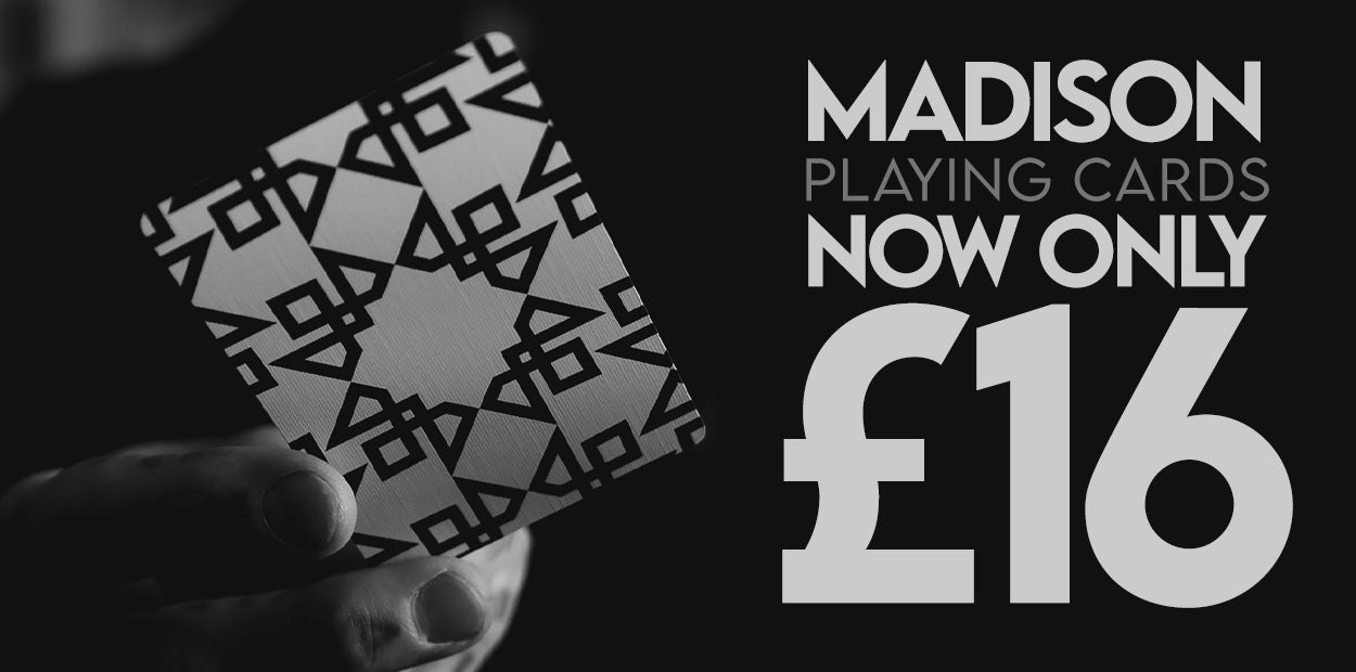 Playing card with geometric pattern held by a hand, promotional text for Madison Masters playing cards on a black background. £16 per deck. 