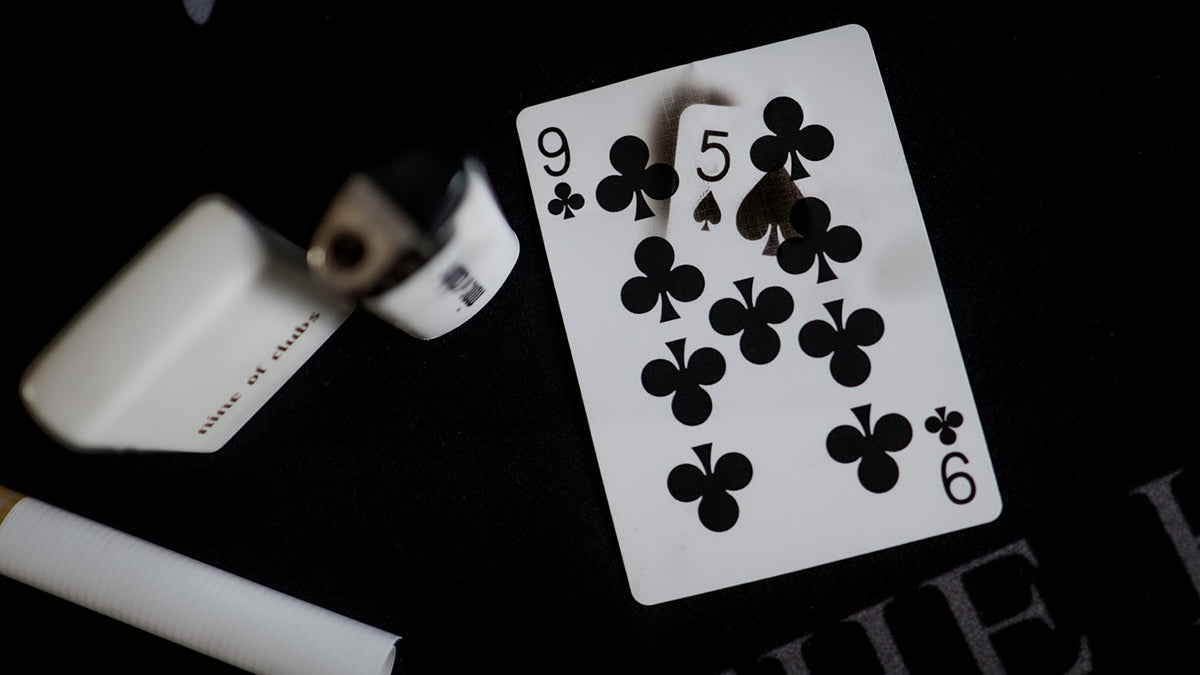 Daniel Madison 9 of Clubs with a  BURN revelation of the 5 of Spades - BURN by Daniel Madison and Eoin O'hare of the Perfect Shuffle template for playing card revelations BURN trick