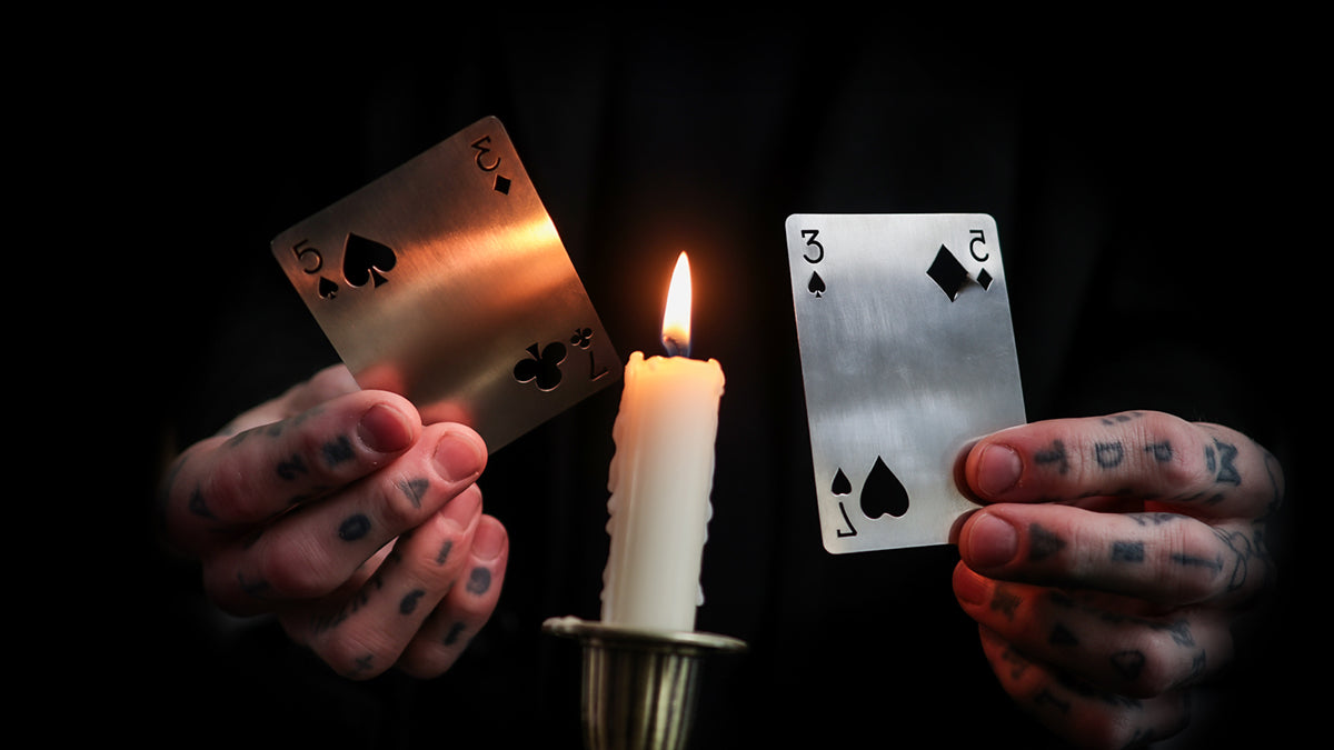 Daniel Madison holding the BURN tools - BURN by Daniel Madison and Eoin O'hare of the Perfect Shuffle template for playing card revelations BURN trick