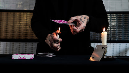 Daniel Madison creating a BURN Revelation Card with the BURN and a lighter - BURN by Daniel Madison and Eoin O'hare of the Perfect Shuffle template for playing card revelations BURN trick