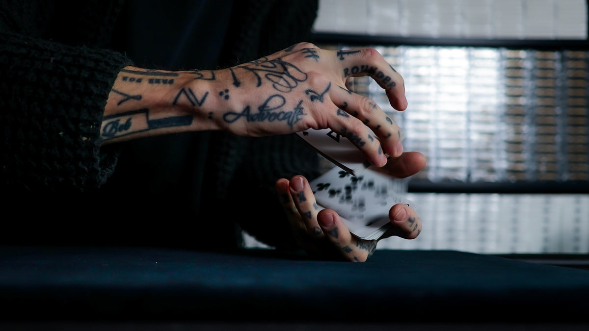 Daniel Madison - the 9 of Clubs and the Mad Deck blue Svengali playing cards dribbling the cards