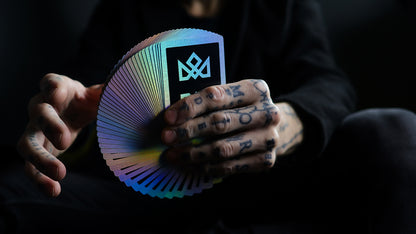 Holographic acolyte playing cards by Daniel Madison fanned to show rainbow effect for cardistry and card magic