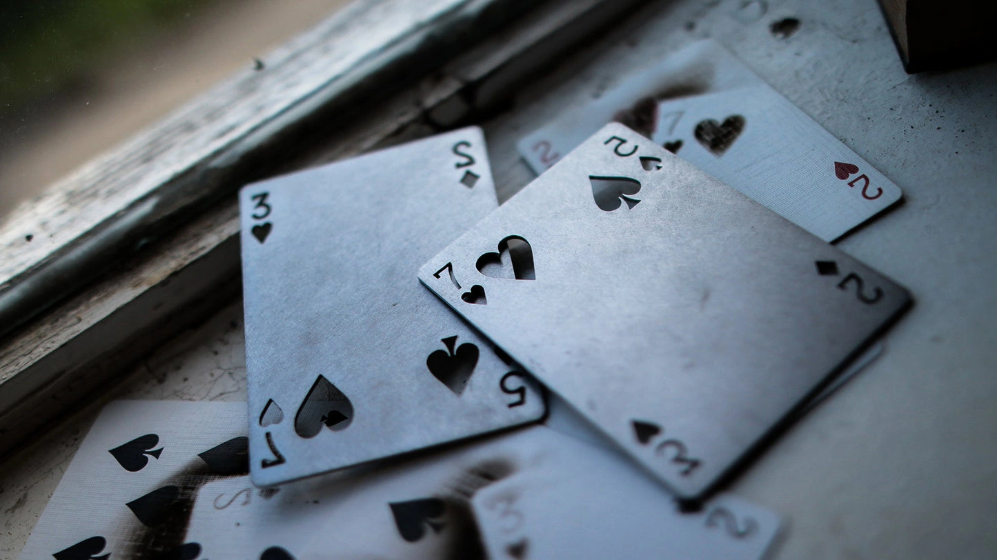 INFLICTION gimmick blister effect demonstration - squeeze the deck and blisters appear on fingers 1 and 2 revealing selected playing card, made from red CHARLATANS
