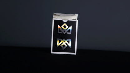 Holographic acolyte magic playing cards by Daniel Madison. Image shows rainbow effect on tuck box. Black background and holo acoloyte inverted logos.
