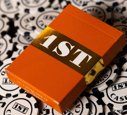 Orange card box with '1ST' text on a patterned background