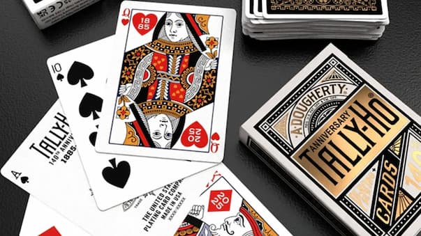 Playing cards with a focus on a deck labeled 'Tallulah' and a Queen of Hearts card.