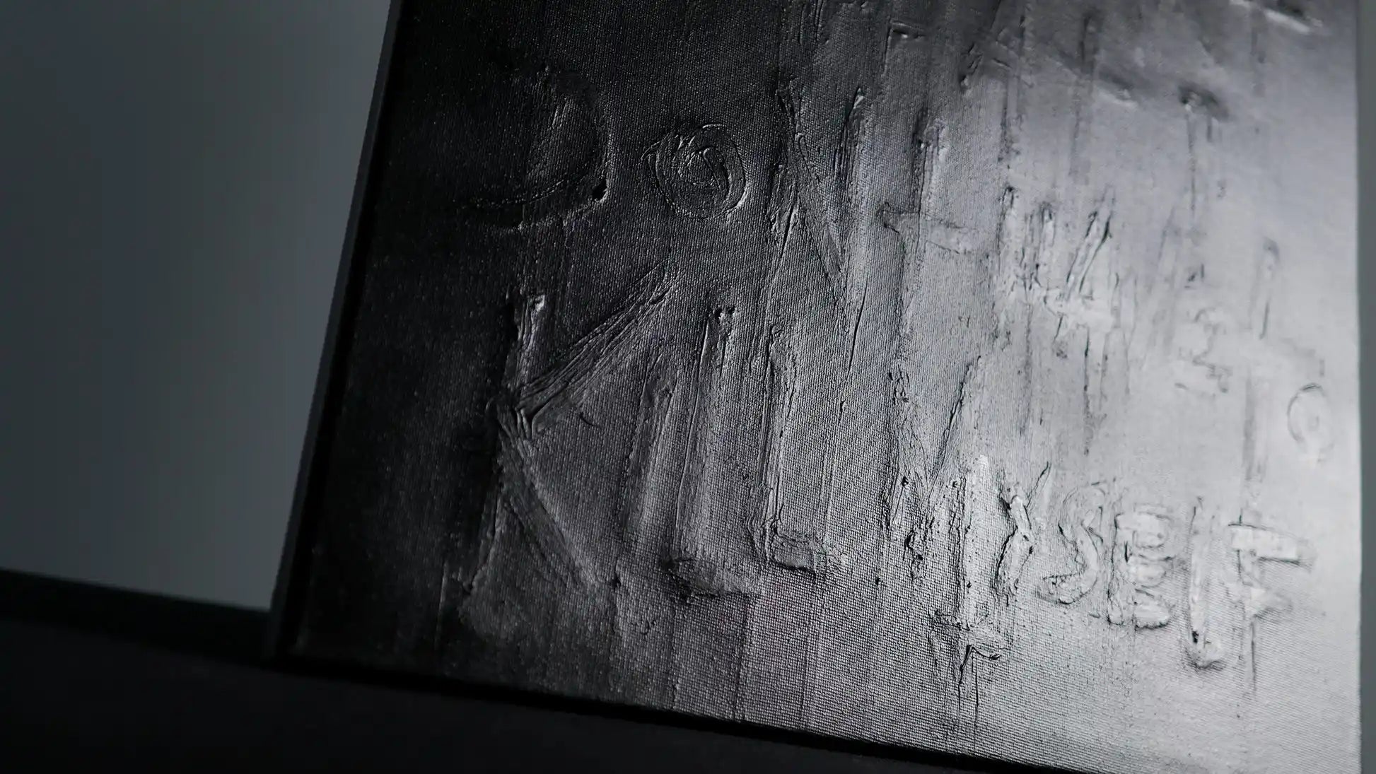 Second layer of SURVIVAL - Daniel Madison adding black paint to hide truth, but message remained raised from canvas, creating secret message hidden in open, filmed in 2025