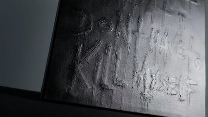 Second layer of SURVIVAL - Daniel Madison adding black paint to hide truth, but message remained raised from canvas, creating secret message hidden in open, filmed in 2025